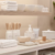 Clean professional waxing salon treatment room with wax applicators, skincare products, towels, and hygienic beauty tools.