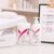 LYCON professional waxing products arranged beside a waxing menu board in a clean spa setting with pink floral accents.